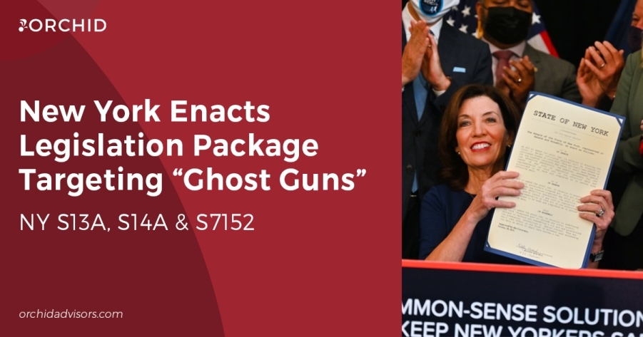 White text atop red background next to photo of New York Governor Kathy Hochul holding signed legislation